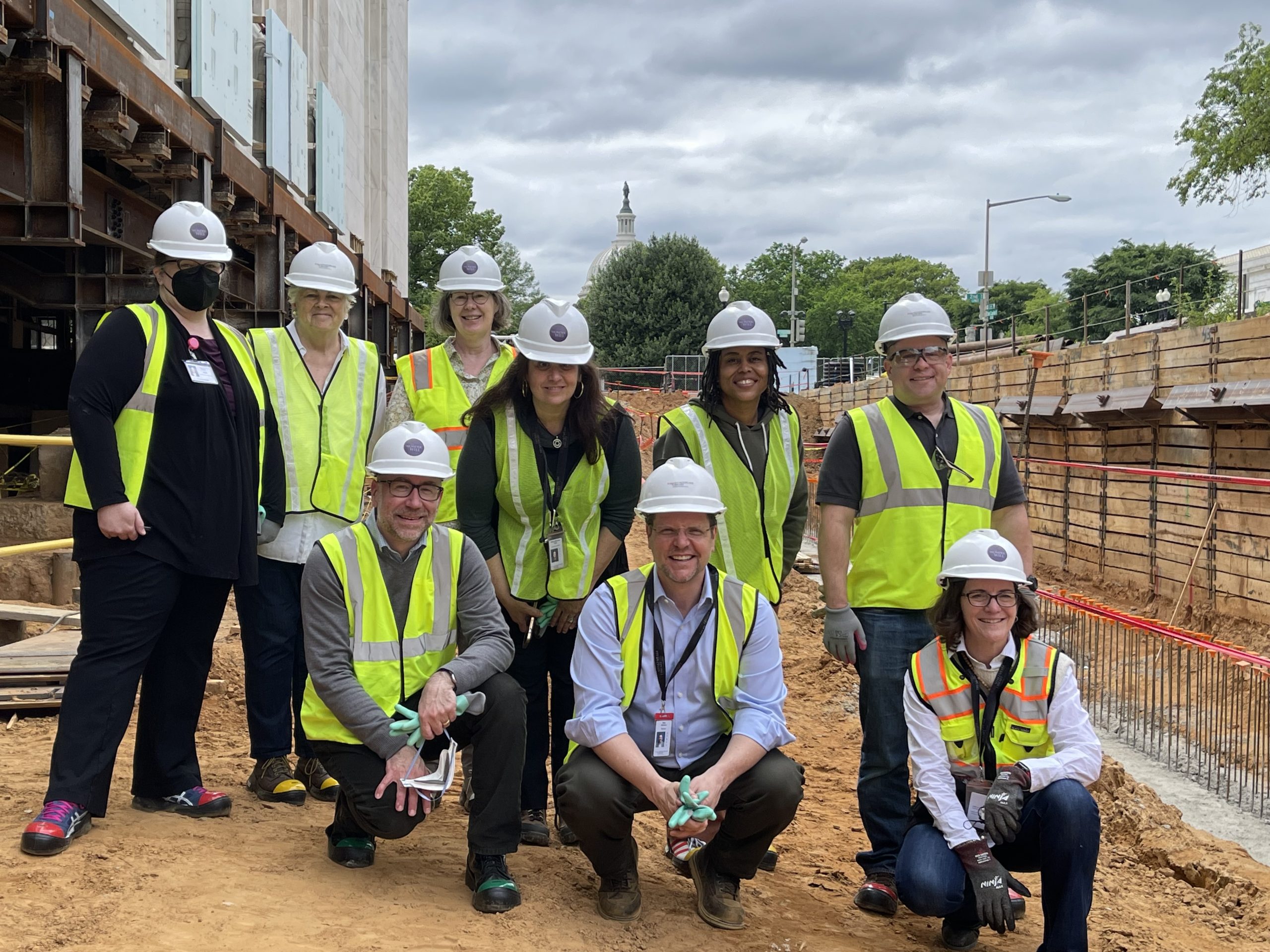 The renovation team, with the U.S. Capitol behind
